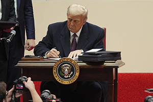 Trump’s action echoed his directive in 2017, when he announced that the U.S. would abandon the global Paris accord.&nbsp;Image Credit: AP Photo/Matt Rourke